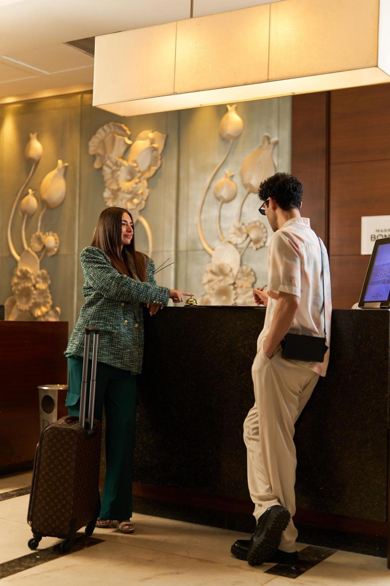 Renaissance Cairo Mirage City Hotel Exterior photo A hotel receptionist