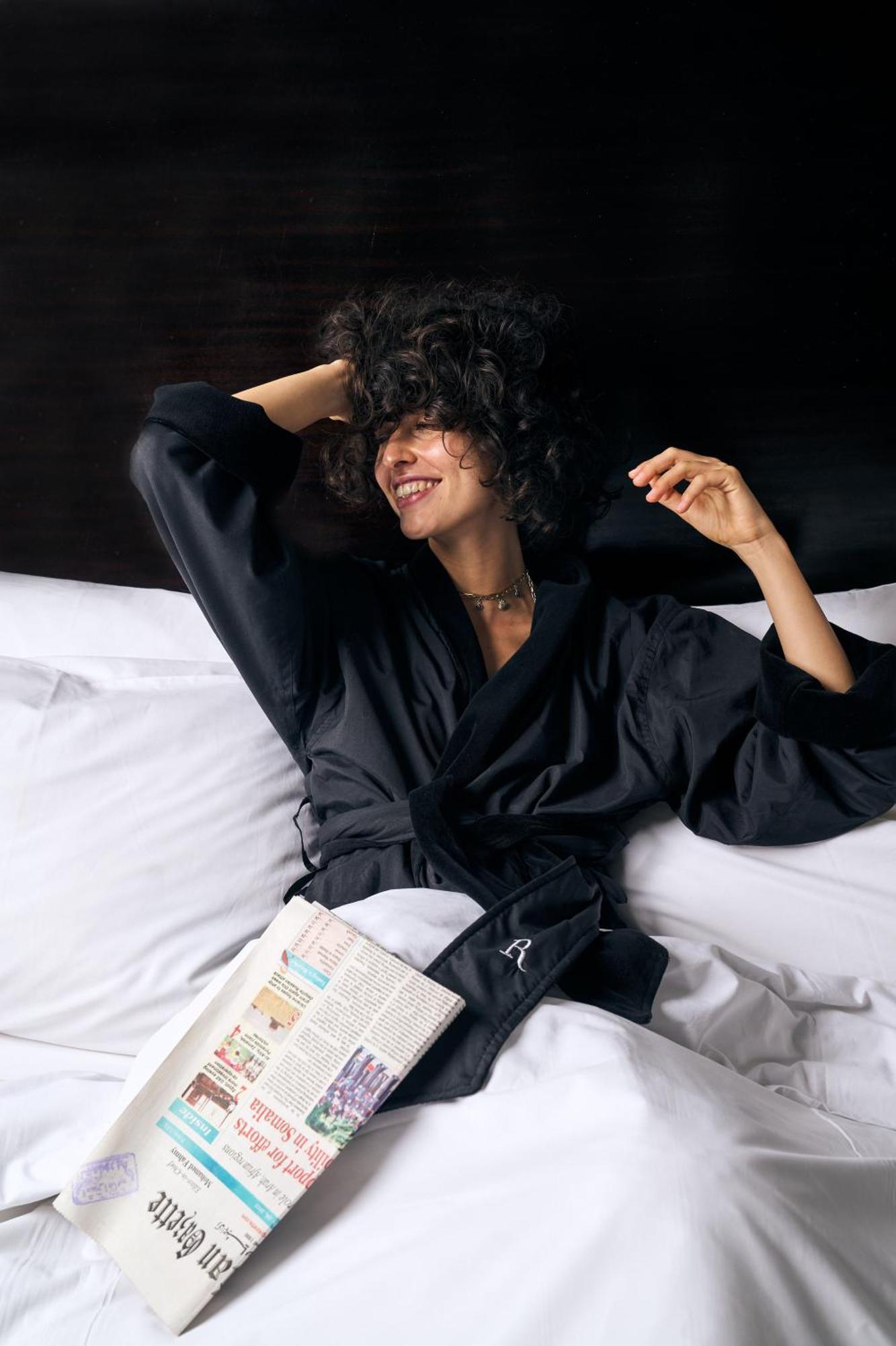 Renaissance Cairo Mirage City Hotel Exterior photo A woman wearing a bathrobe